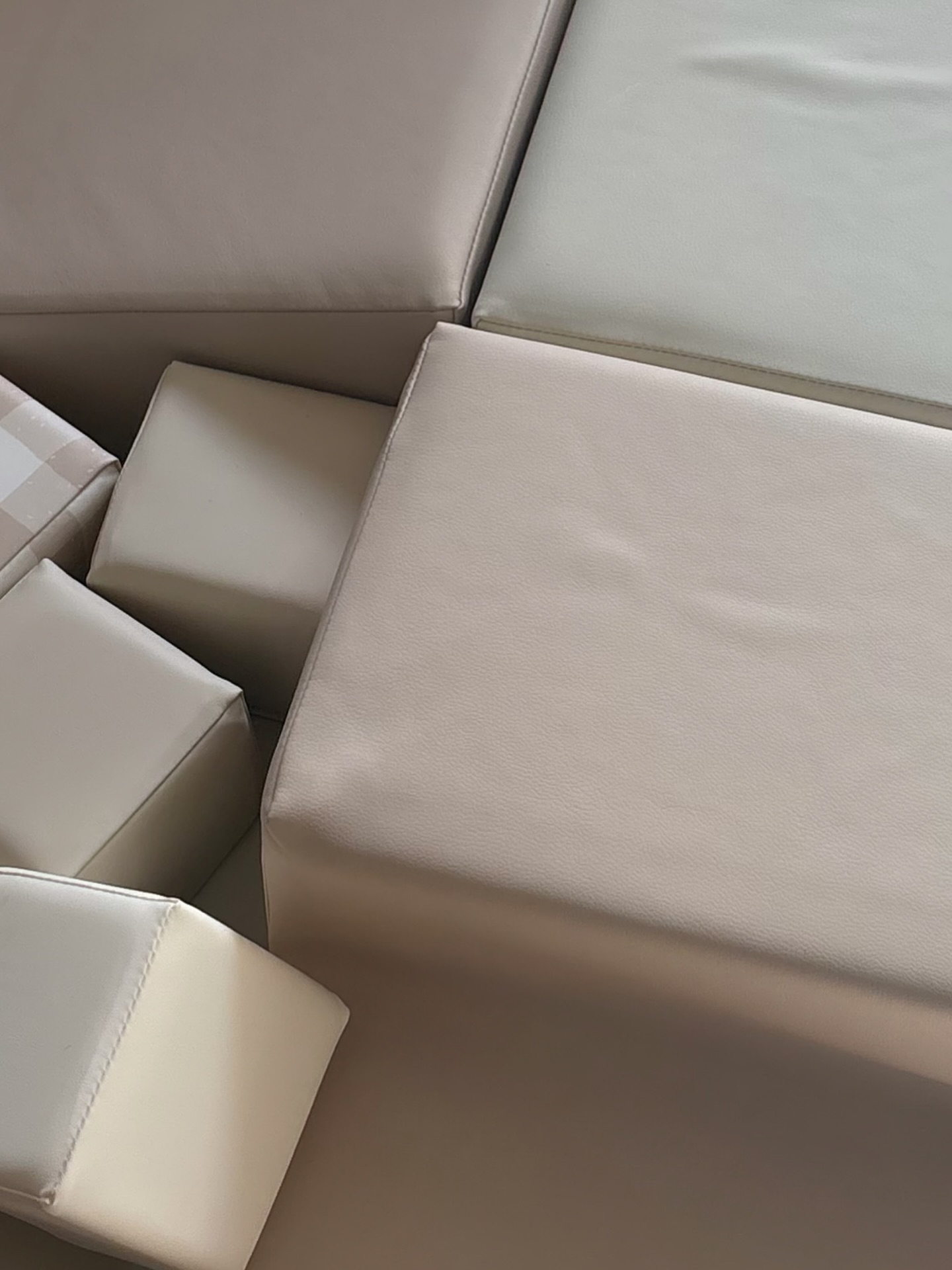 Close detail of cream and gingham soft play blocks
